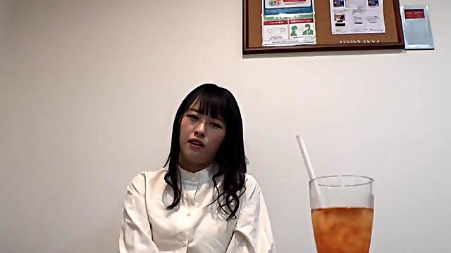 A girl in fishnets is having fun with a toy and vibrator