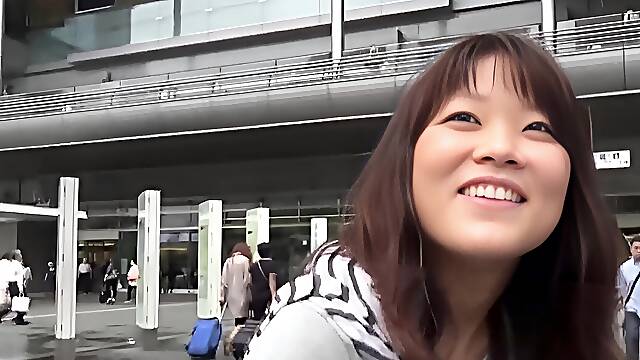 Asian pees a stream onto street