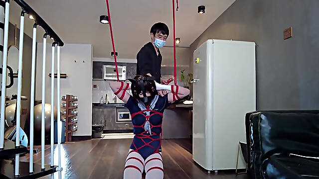Mz31 - a Girl Tied and Suspended by a Red Rope Reaches Orgasm.